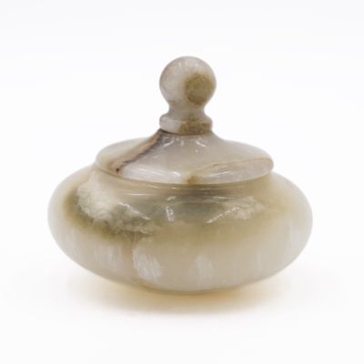 a picture of a small glass jar with a lid