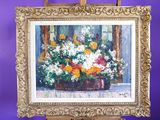 une photo d'un tableau représentant des fleurs dans un vase posé sur un chevalet