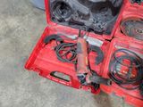 a red tool box with tools in it on the floor