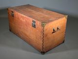 an old wooden trunk with a metal latch on it