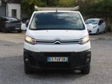 a white van that is parked in the parking lot