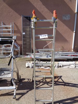 a metal ladder that is next to a building