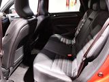 a red car with black seats in the back of it