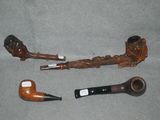 a pipe and a pipe holder sitting on a table