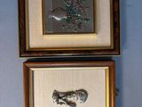 two framed pictures of a cat and a fish on a blue wall