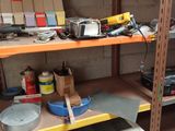 a shelf full of tools and other items in a room