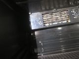 a black oven with the door open in the kitchen