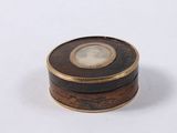 a small wooden box with a picture of a woman on it