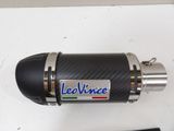 a close up of a motorcycle exhaust pipe on a table