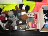 many balls of yarn in a box on the floor