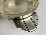 a silver plate that is sitting on a table
