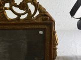 someone is taking a picture of a mirror with a camera in front of it