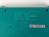a green electronic device that is sitting on a table