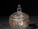 an image of a glass jar with a lid on a table