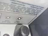 a close up of a machine with a lot of buttons on it