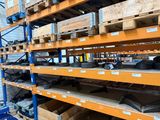 a large rack with lots of items on it in a warehouse