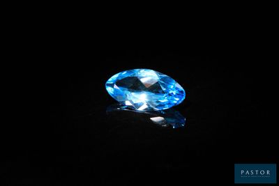a blue topazte gems on a black background