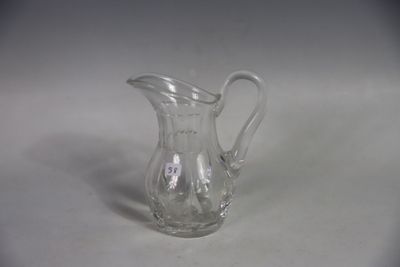 a glass pitcher that is sitting on a table