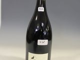 a bottle of wine that is sitting on a table