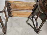 a wooden chair that is sitting next to a dresser