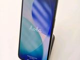 a phone that is sitting on a stand on a table