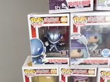 a lot of pop figures in the boxes on the table