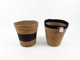 two woven baskets with black and white stripes on them