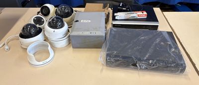 many cameras that are sitting on a table