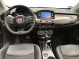 the interior of a small car with a steering wheel and dashboard controls