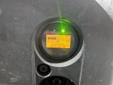 a close up of a parking meter with a green light