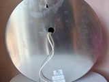 a picture of a metal object on a white table