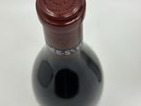 a bottle of wine that is sitting on a table