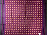 a close up of a purple and red square pattern on a black background