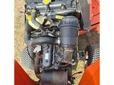 an overhead view of a lawn mower with the engine exposed