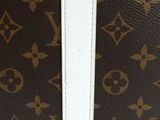 louis vuitton monogram canvas travel bag with white trim
