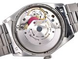 a close up of a watch on a white background