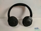 a pair of headphones sitting on top of a white surface