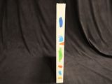 une image représentant une grande feuille de papier sur laquelle figurent des formes de différentes couleurs
