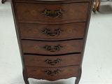 a marble top chest of drawers on display in a store