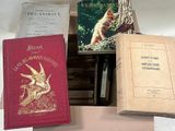 three books sitting on a table next to each other