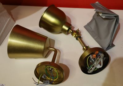 two lamps that are on a table next to each other