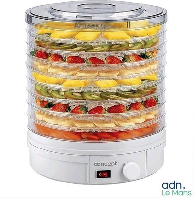 une photo d'un déshydrateur alimentaire contenant des fruits et des légumes