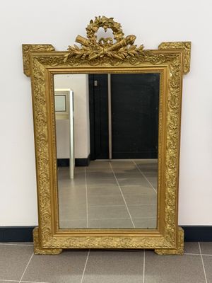 a mirror that is sitting on the floor in a room