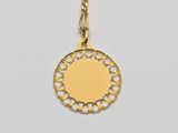 a gold necklace with a circular medallion on a gold chain