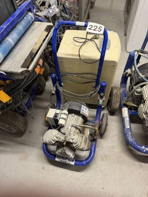 two machines sitting next to each other on the floor