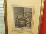 une vieille photo montrant un groupe d'hommes assis autour d'une table