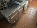 an image of a commercial kitchen with a lot of appliances