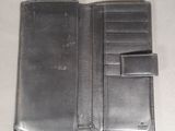 leather wallet with a card holder on top of it on a table