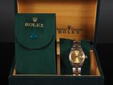 an image of a rolex watch in a box with a watch case