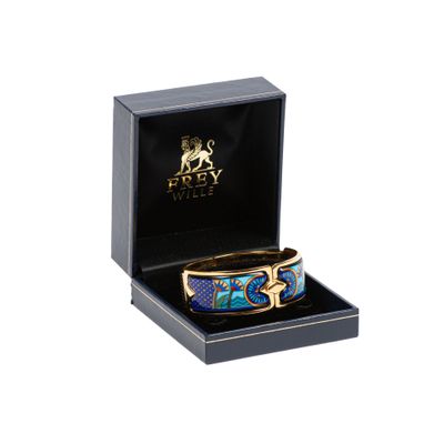 une photo d'un bracelet bleu et or dans un coffret noir